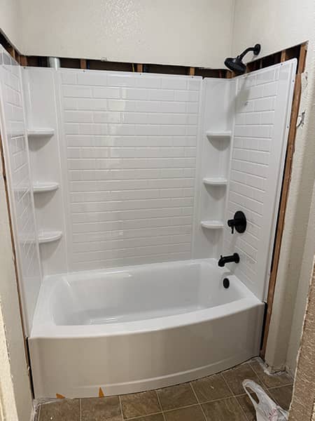 New bathtub and surround installed by CH Plumbing