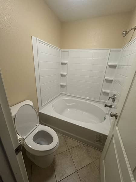 New toilet and tub surround installed in a High Desert bathroom