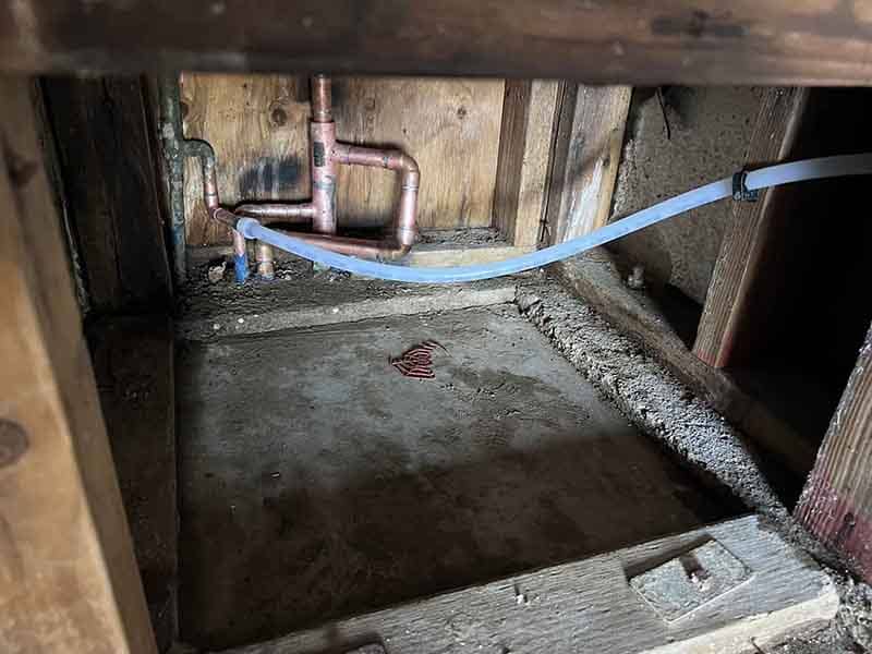 New construction plumbing rough-in with clean copper and PEX supply runs